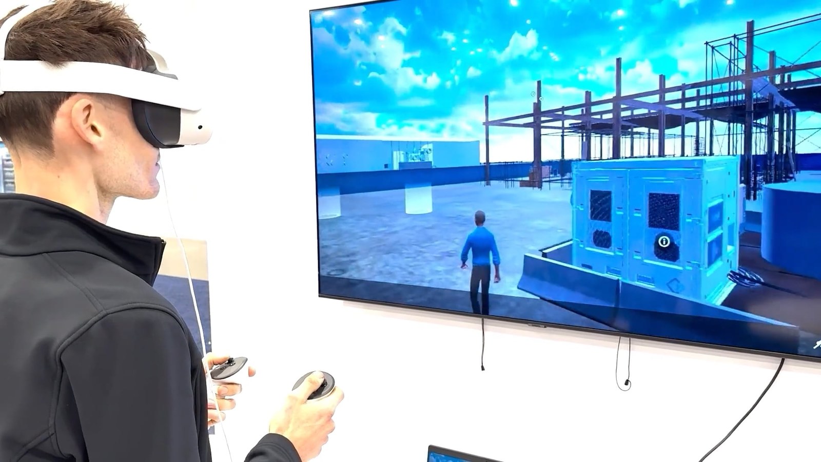 P2VR in action at the 2025 ARA Show: Michael Larsen of The Rental Journal podcast explores the virtual job site in the headset while the booth follows along on screen.